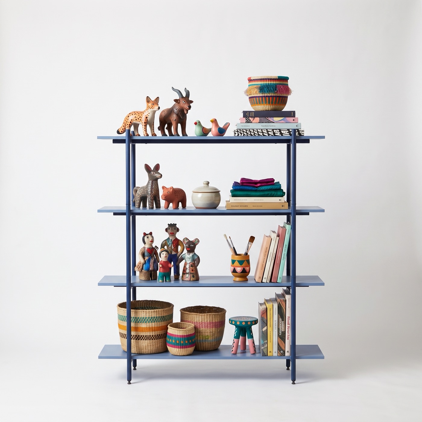 A four-tier shelf in marine blue steel with books, baskets and carved wooden animals.