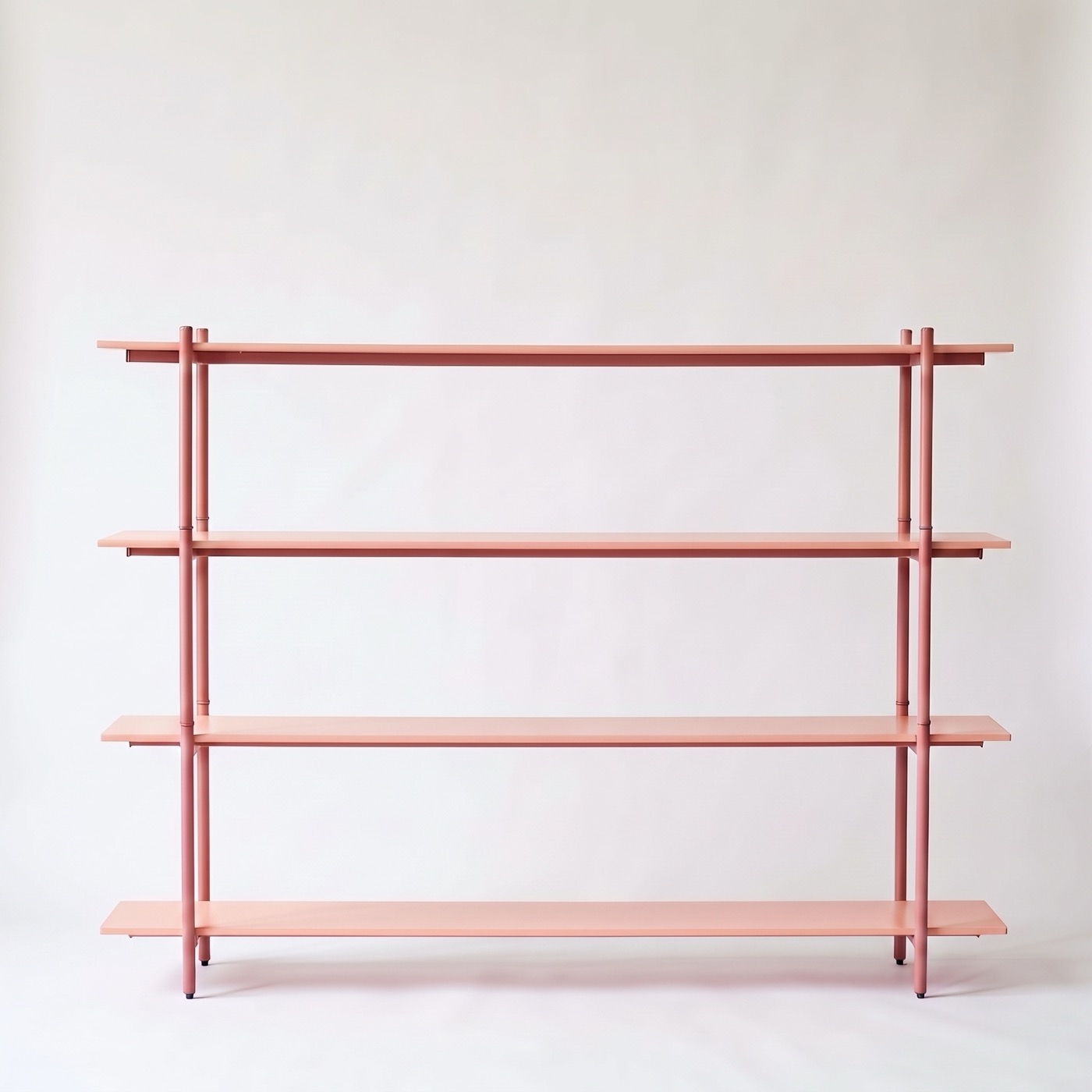 A wide four-tier shelf in Coral, empty